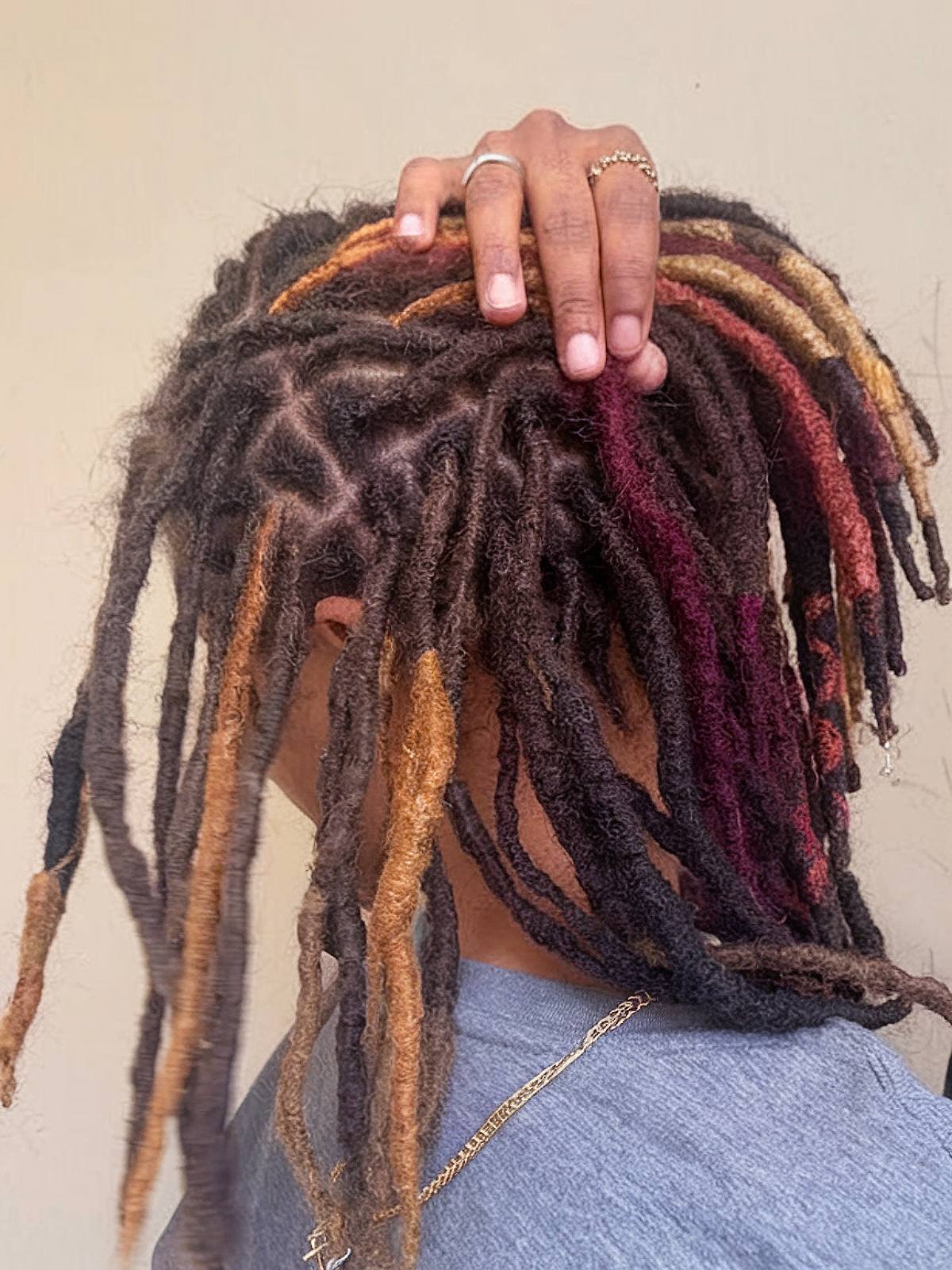 Calico hair color on locs with honey and auburn tones