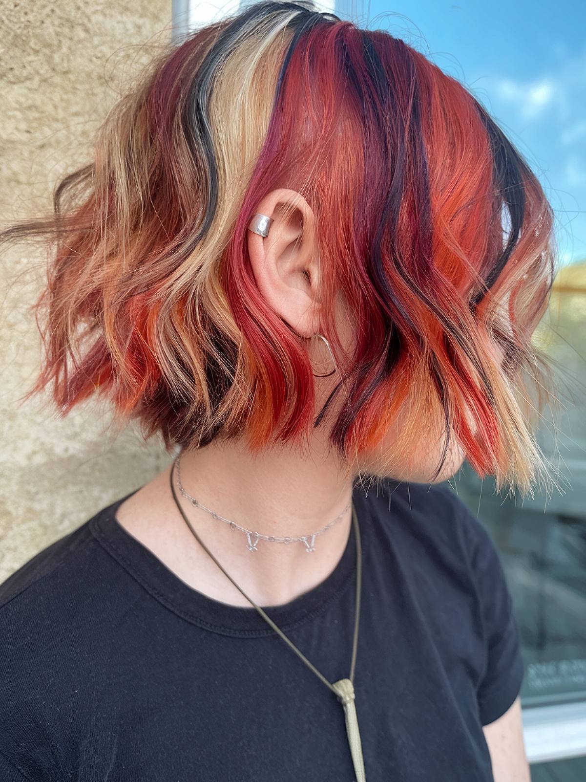 Short calico hair with red, blonde, and black streaks