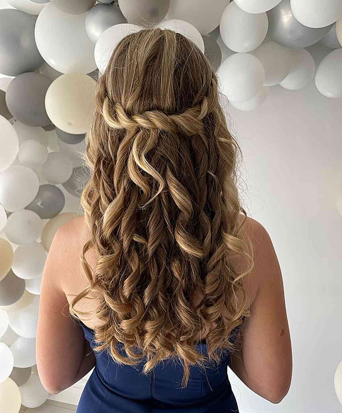 Cascading Twists and Curls on Downed Long Hair for Prom Night
