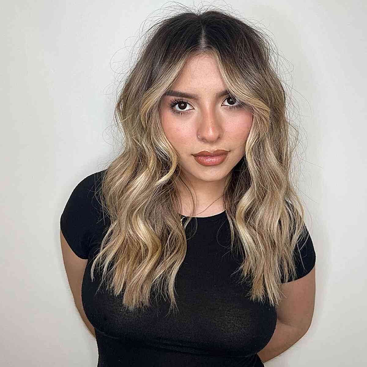 Casual Blonde Balayage with Middle-Parted Dark Roots