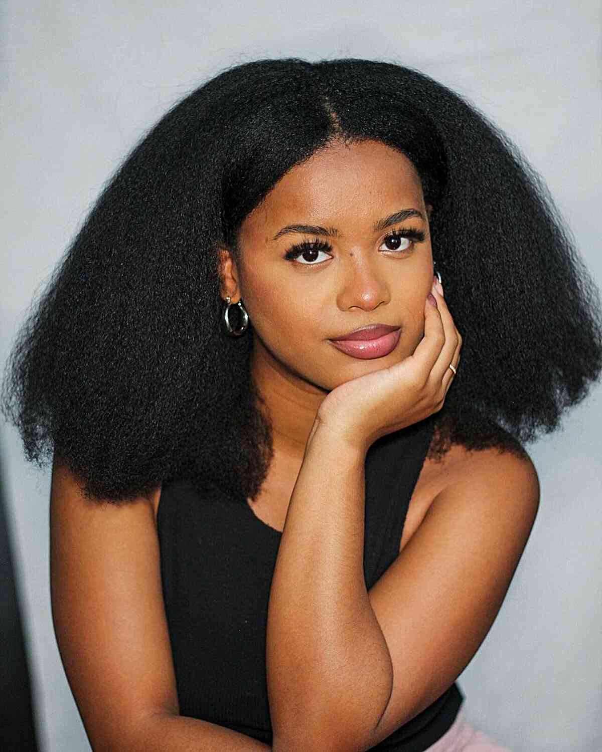 Center-Parted Thick Style with Layers on a Shoulder-Length Cut and Kinky Black Hair