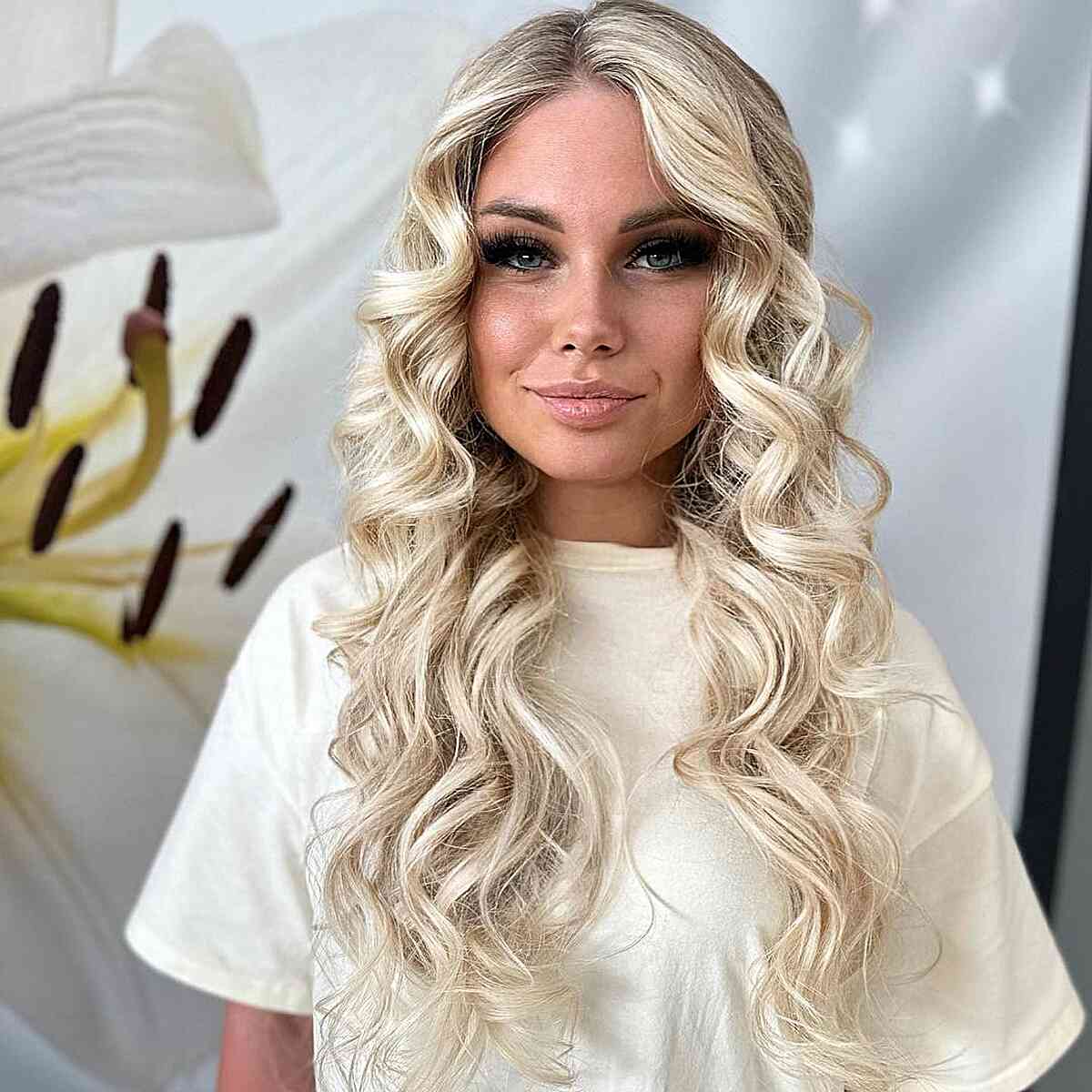 Champagne Blonde Curled Hairstyle with an off center part