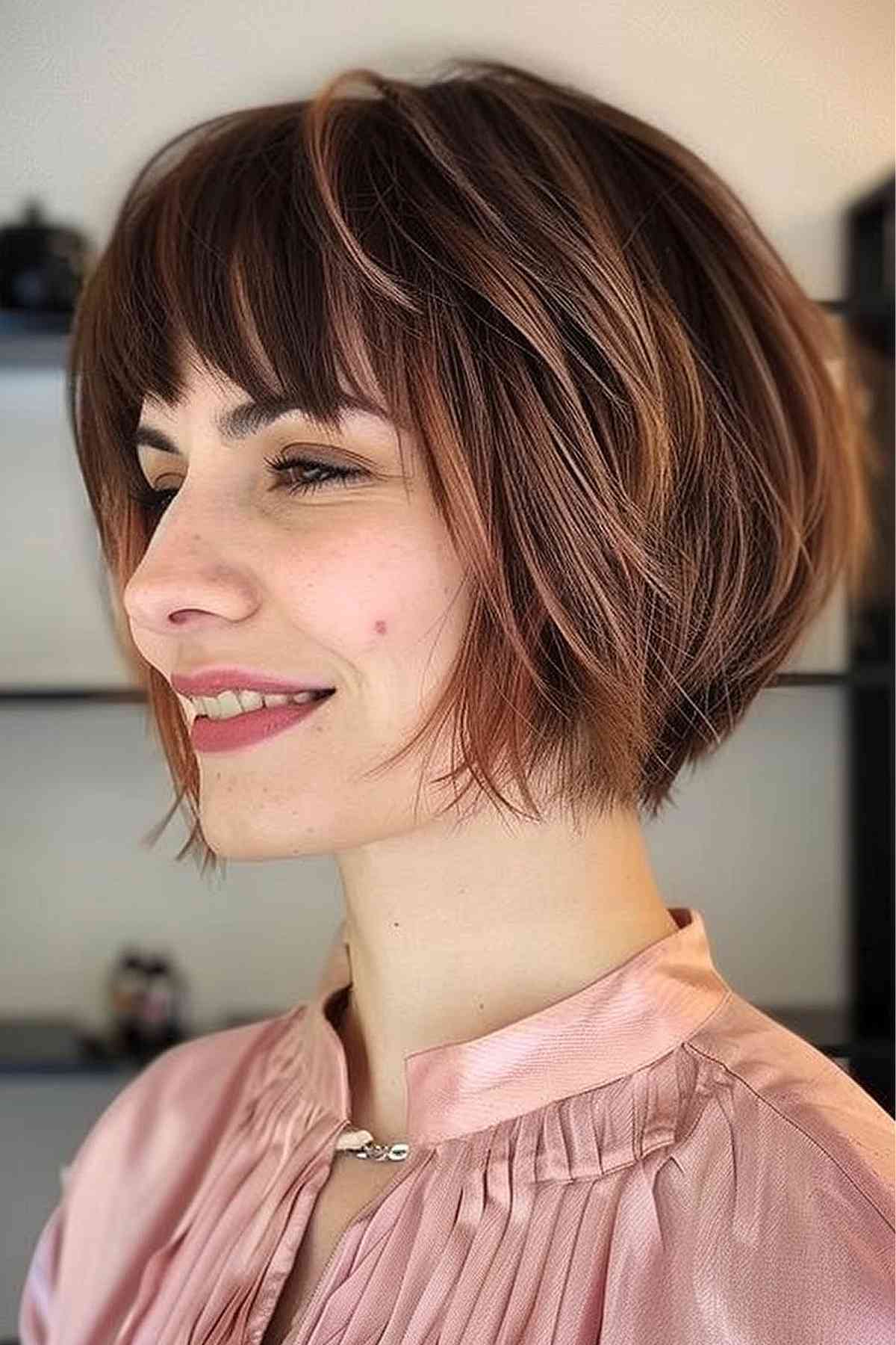 Chanel bob haircut with disconnected layers at the back for added volume