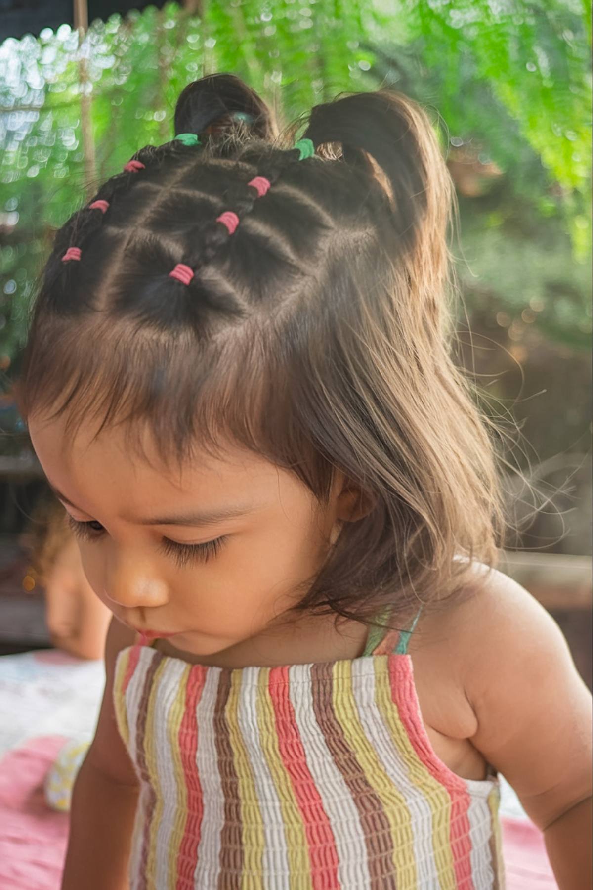 Grid pattern toddler hairstyle with elastics