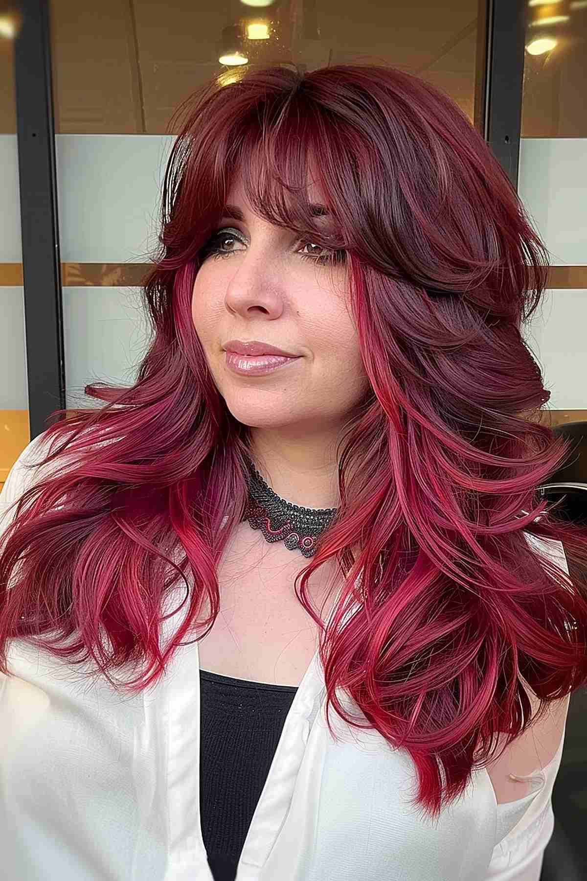 Cherry red layered haircut perfect for fine to medium hair with a 90s vibe.
