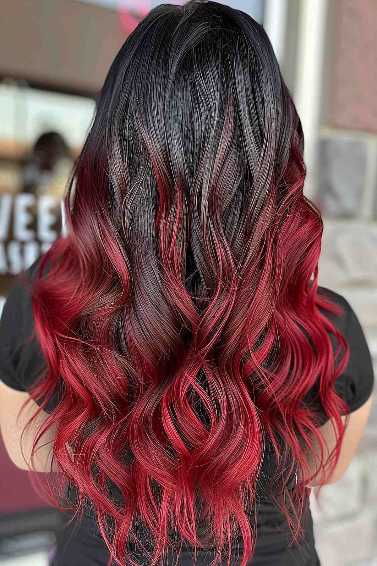 Dark to cherry red ombre hair showcasing a vibrant transition ideal for any hair type.