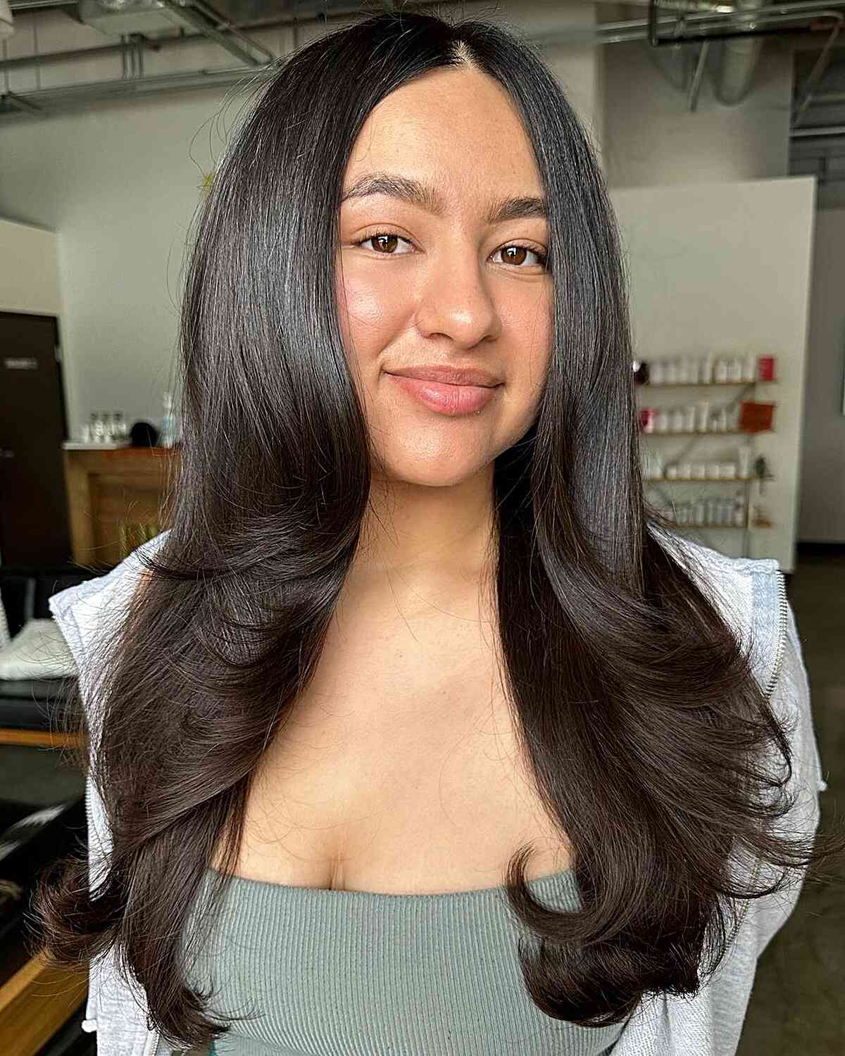 Chest-Length Hair with Lightly Feathered Ends for Round Face Shapes