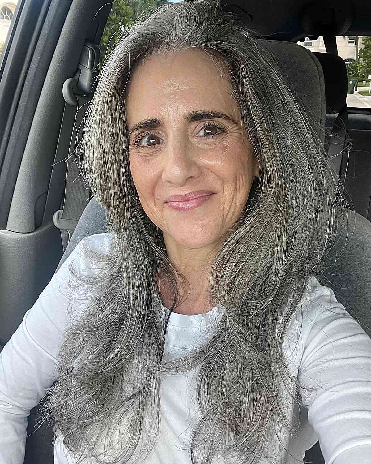 Chest-Length Soft Layered Hair with Flipped-Up Ends for 60-Year-Old Women with Thicker Locks