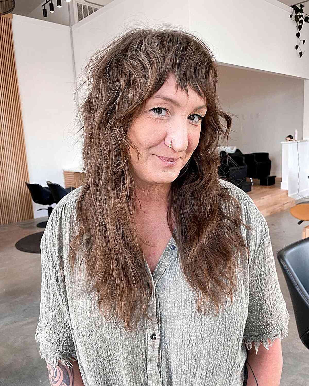 Chest-Length Textured Razor Cut with Short Bangs on 50-year-old Women