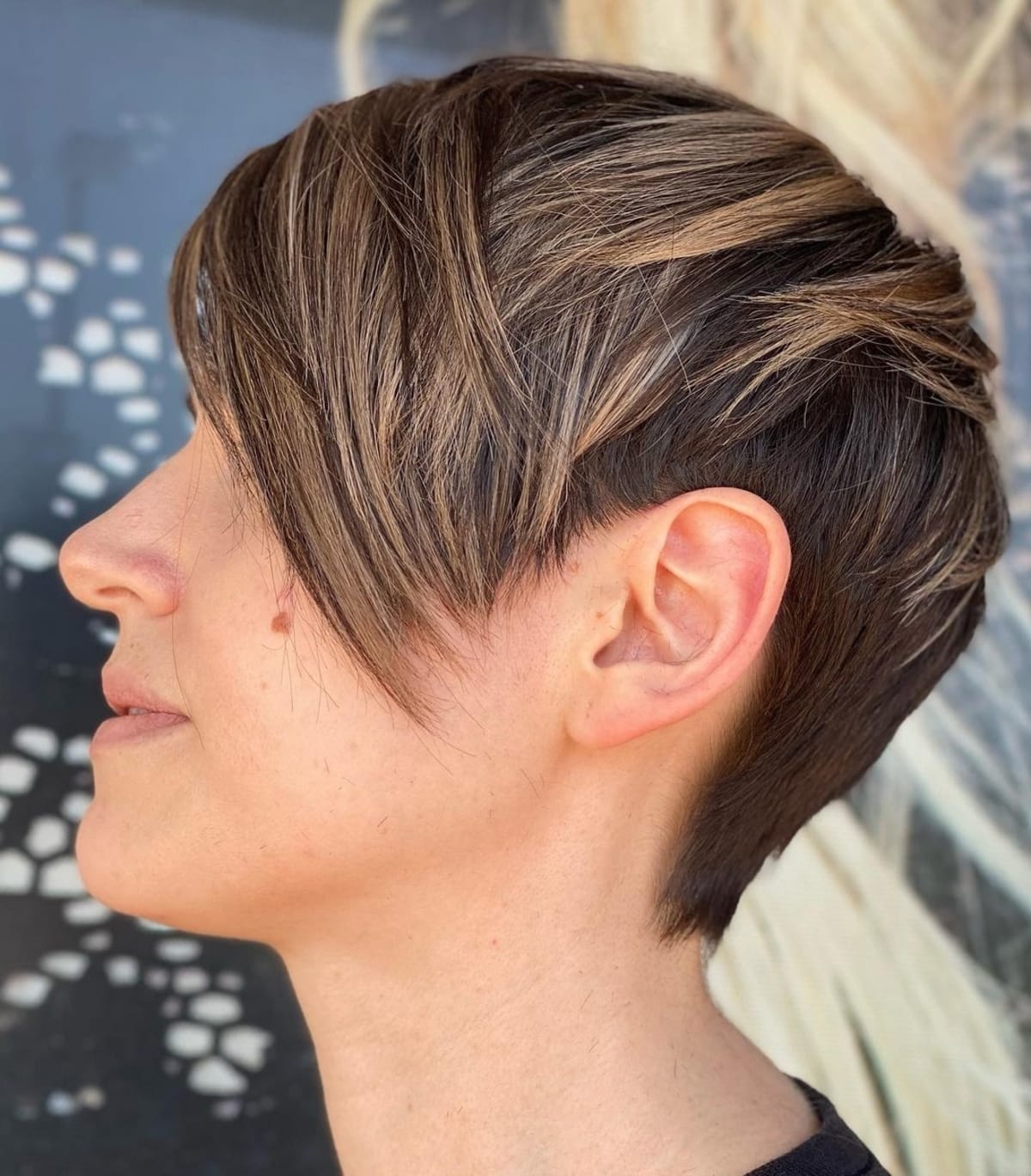 Chestnut brown pixie hair with caramel highlights