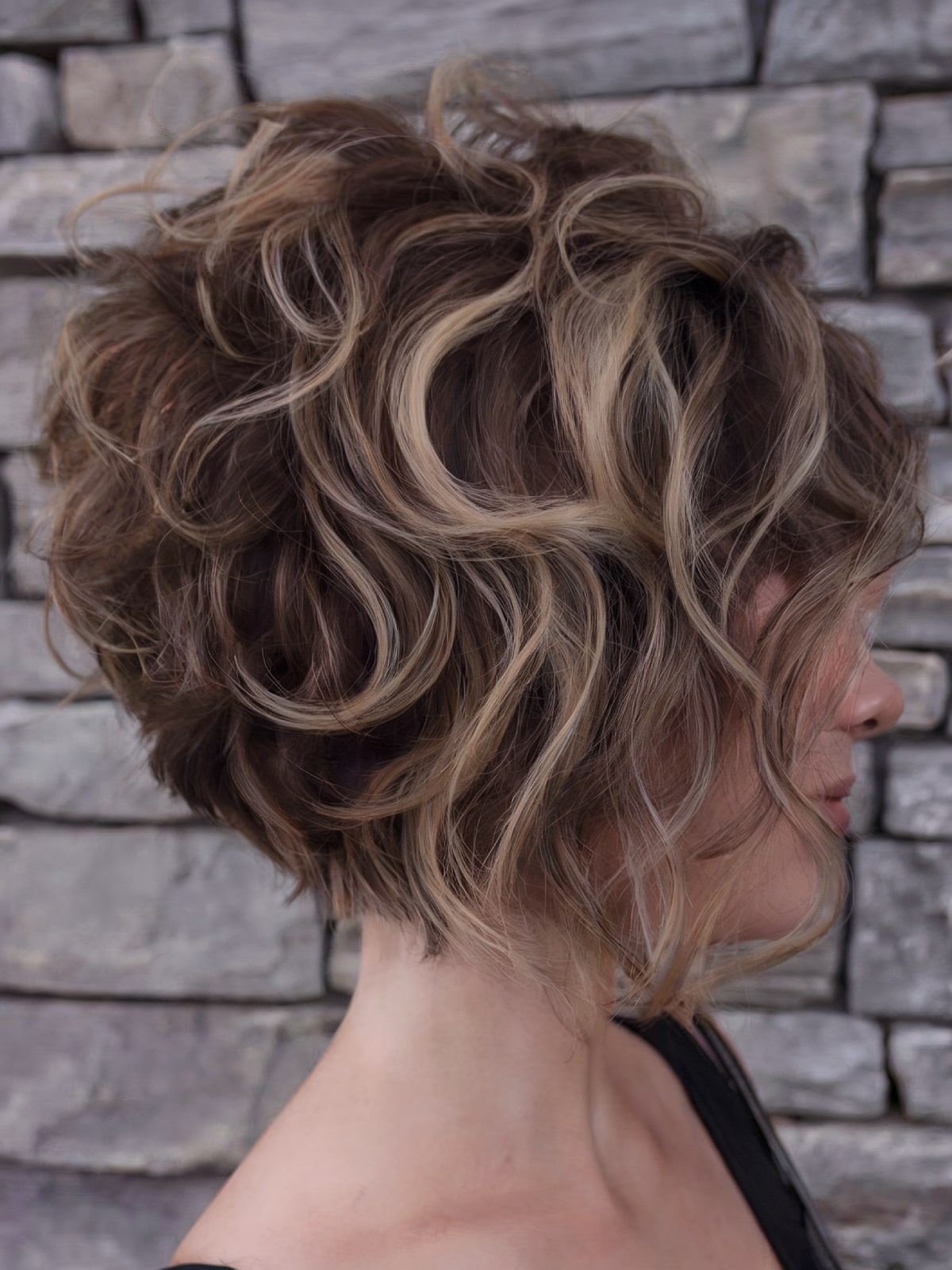 Curly angled bob haircut with textured layers