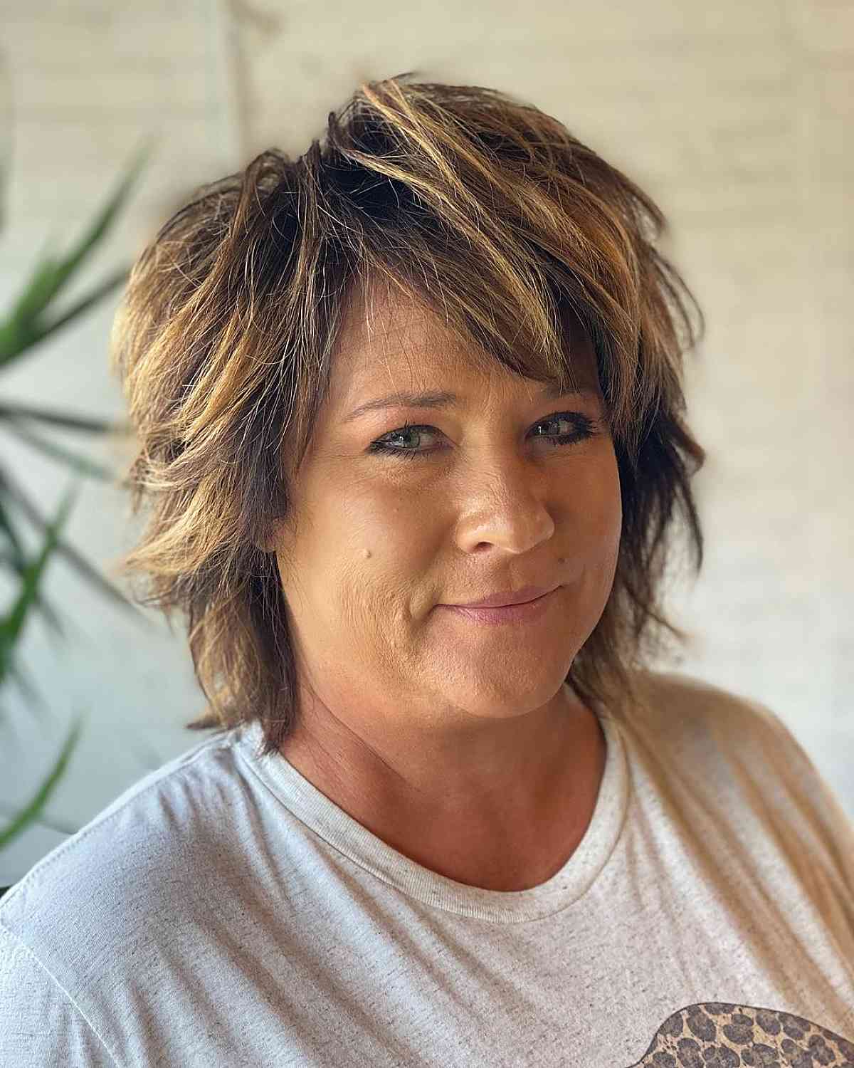 highlights on short hair with longer bangs for women over fifty