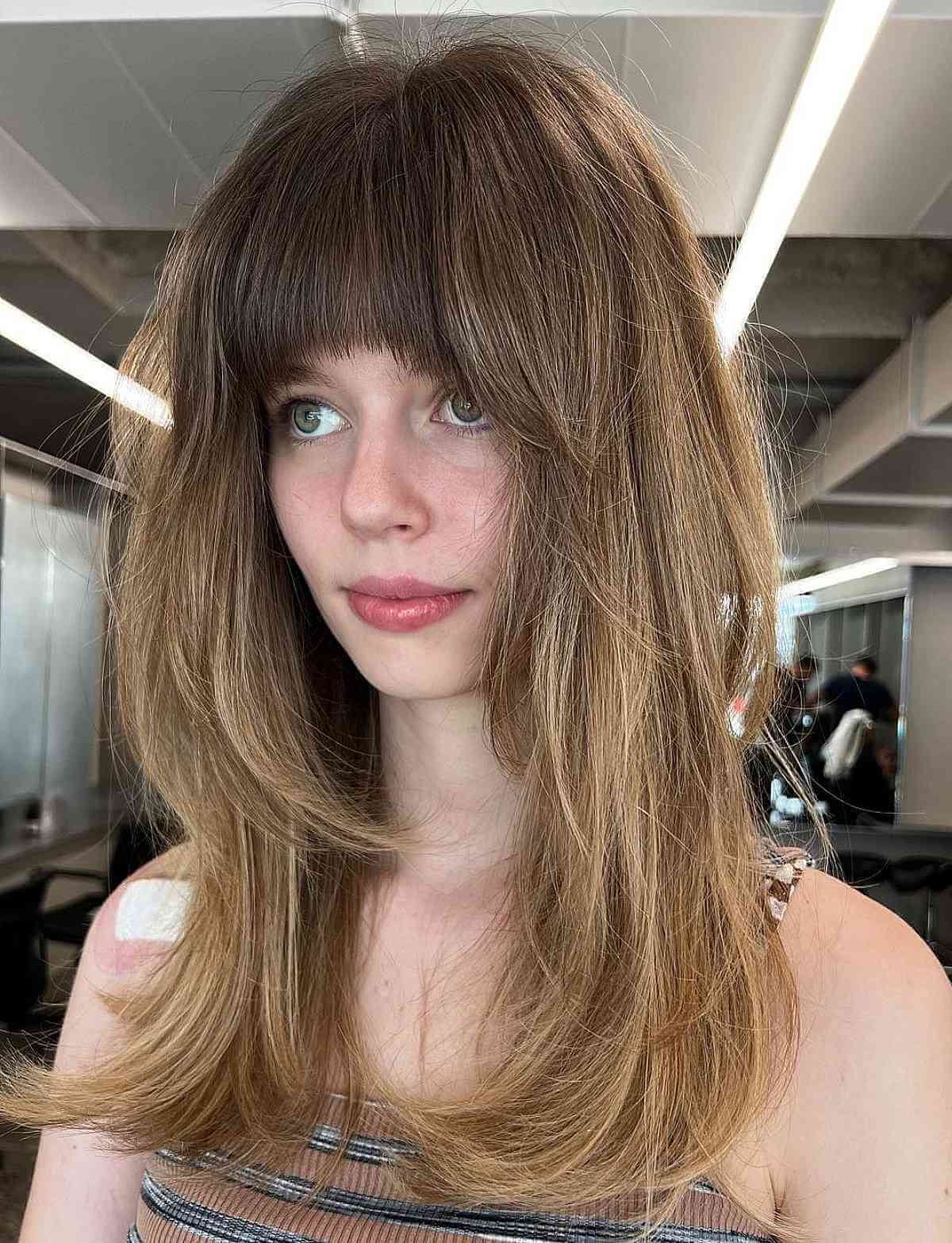 Chic Layered Cut with Textured Bangs for Long Faces