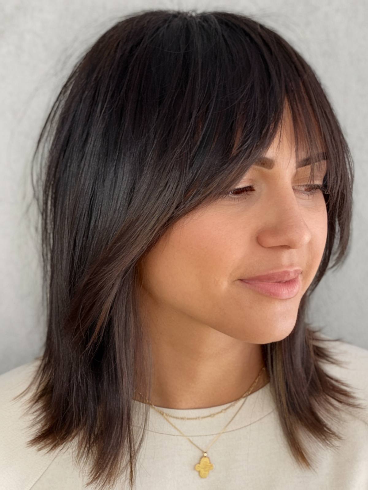 Shoulder-length straight shag with soft bangs and textured layers