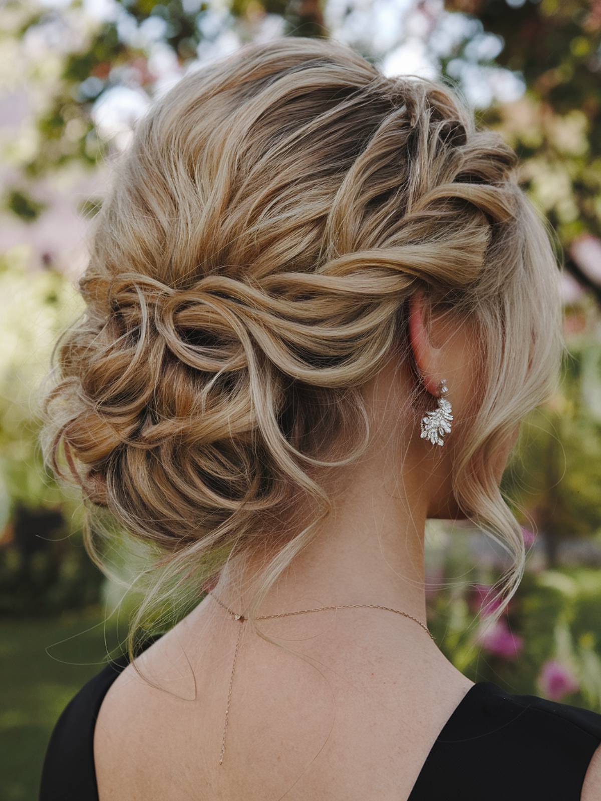 Romantic wavy updo with loose tendrils