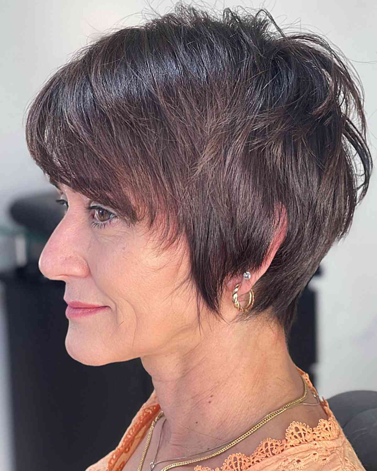 Chic Wixie Pixie Haircut for ladies aged 50 and over with straight hair