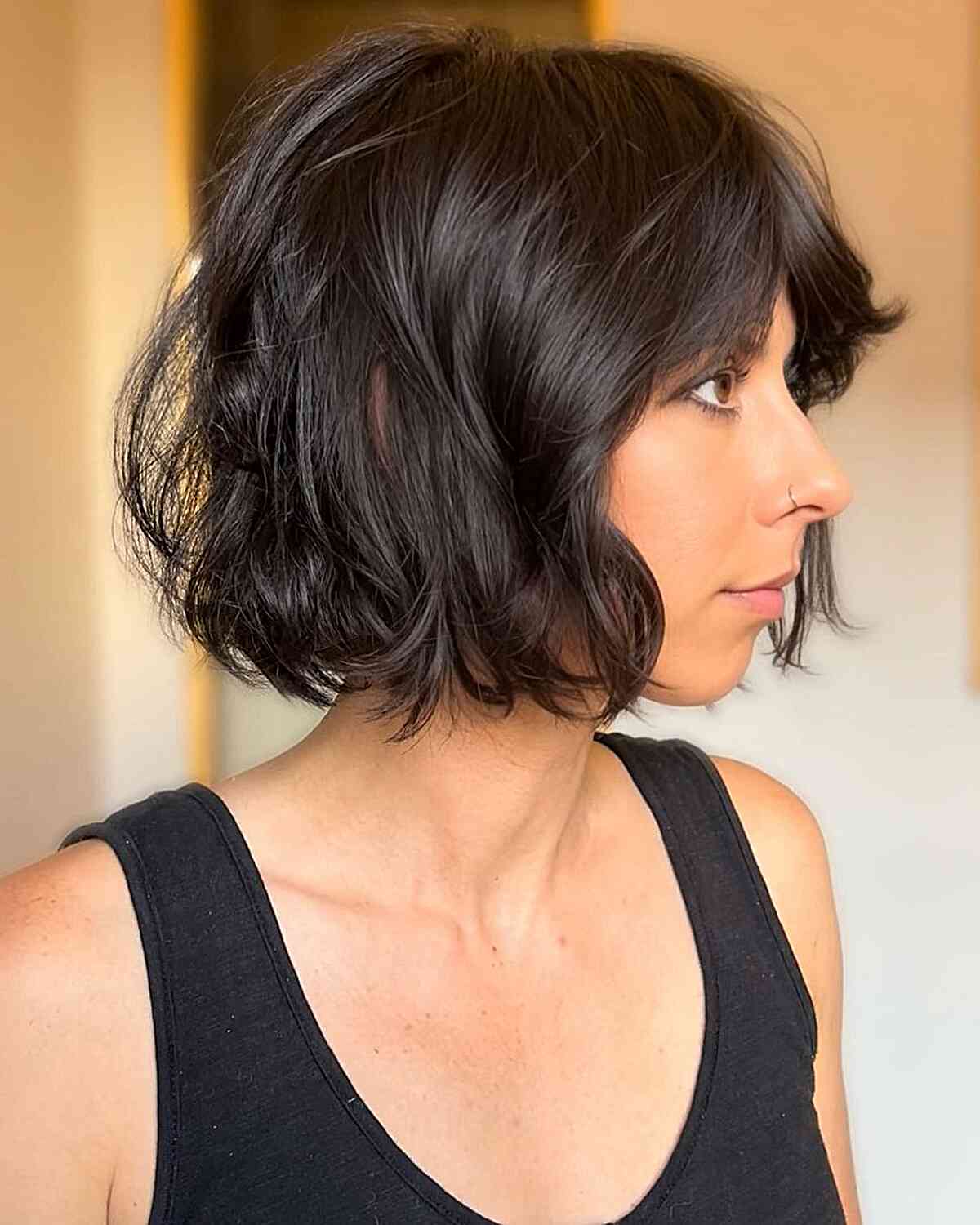 Chin-Grazing Wavy Italian Bob with Middle Part Bangs