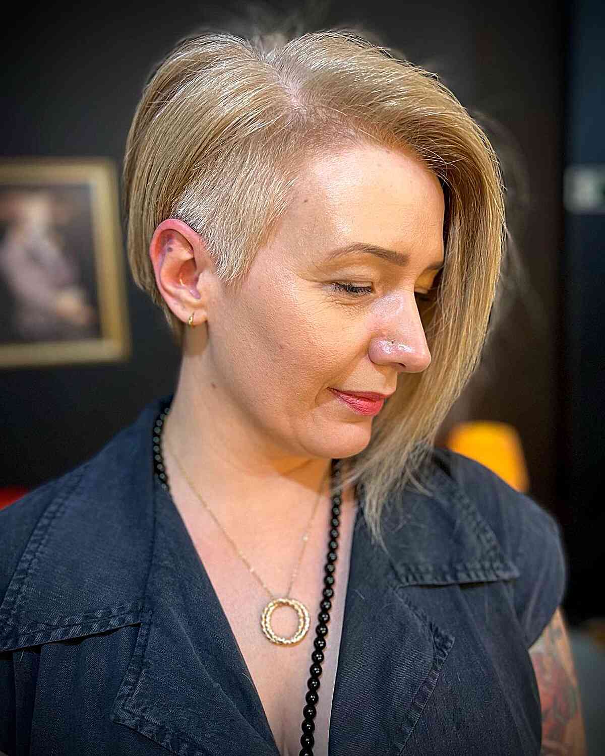 Chin-Length Asymmetrical Pixie Bob with Shaved Side on Old Women