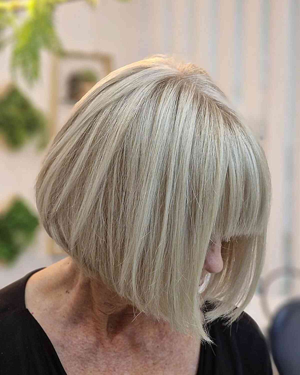 Chin-Length Blonde Bob with Blunt Fringe for women with thinning hair