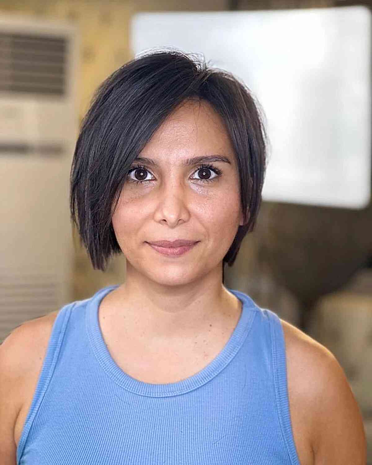 Chin-Length Bob with an Off Center Part and Layers