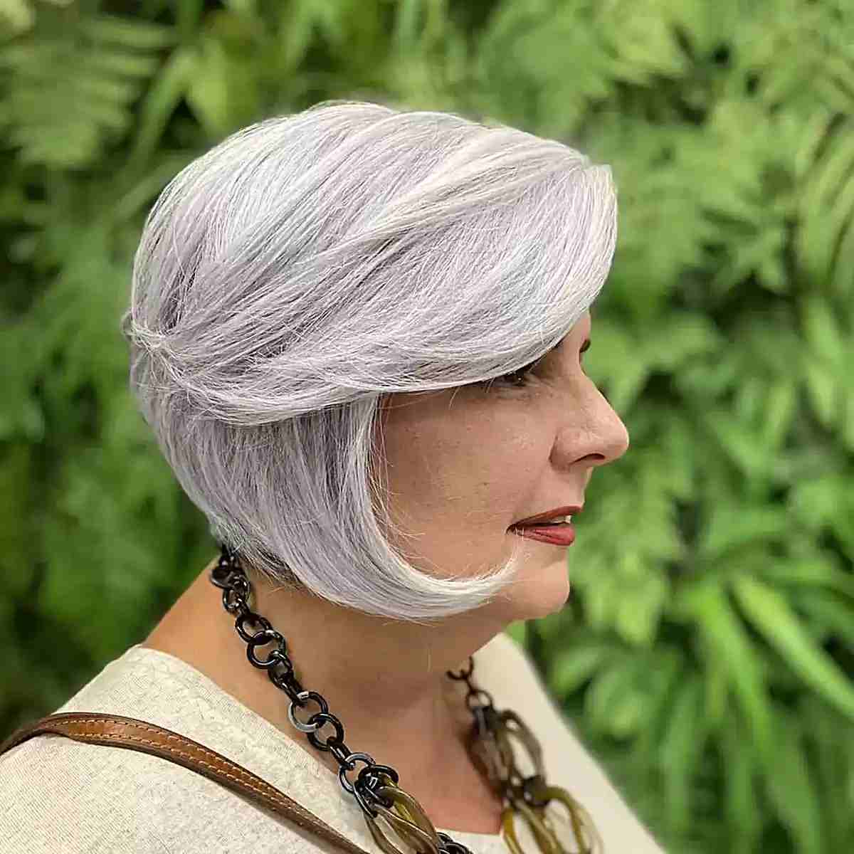 Chin-Length Bob with Swoopy Layers and Side-Swept Bangs for Older Women Over 60