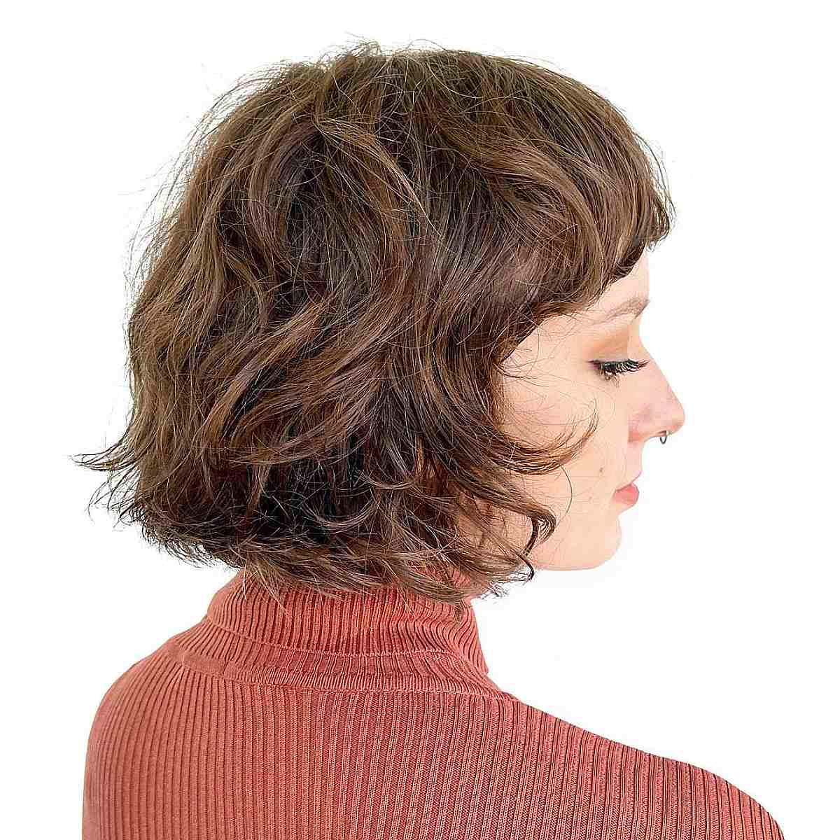 Chin-Length Brunette French Bob with Wavy Flipped Ends