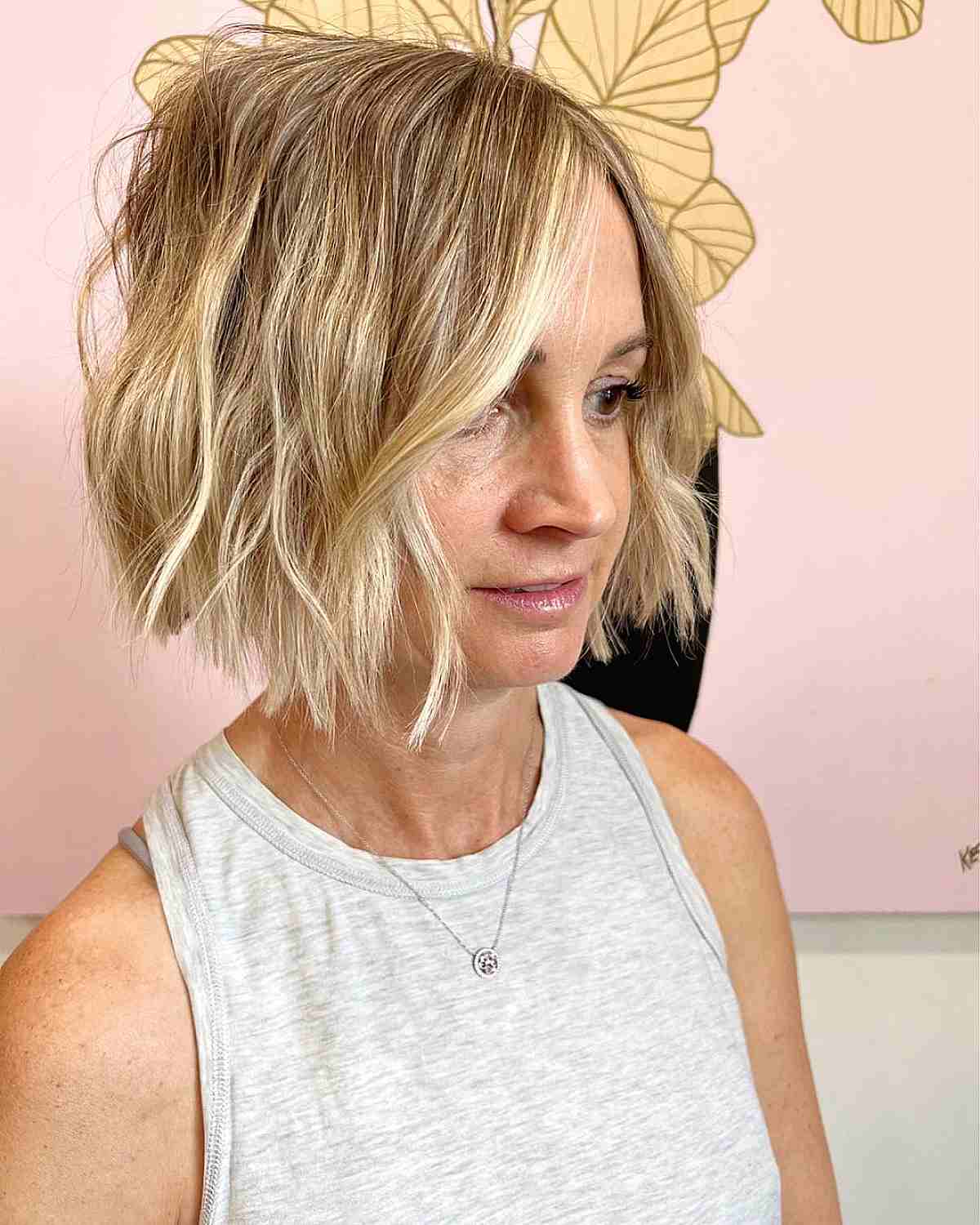 chin length choppy bob with beach waves for women over 40