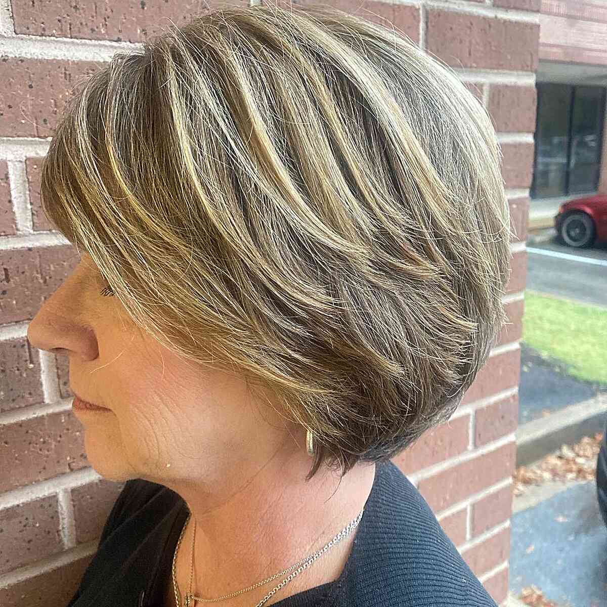Chin-Length Choppy Round Bob with Shorter Layers and Side Bangs for Ladies over 60