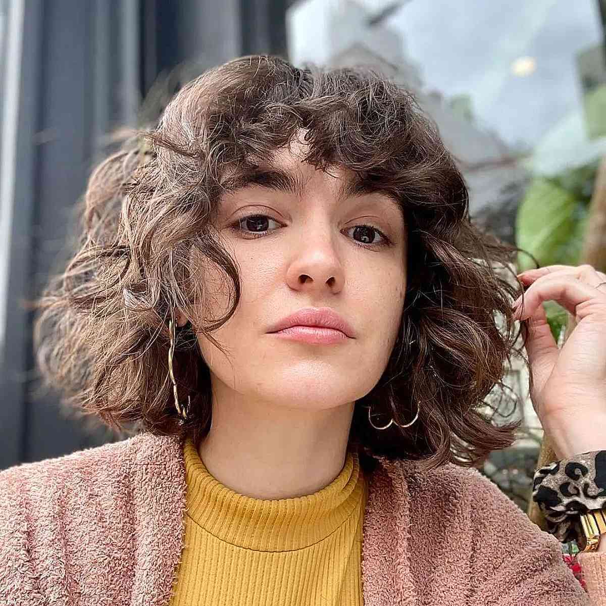 chin length curly bob with bangs for square faces
