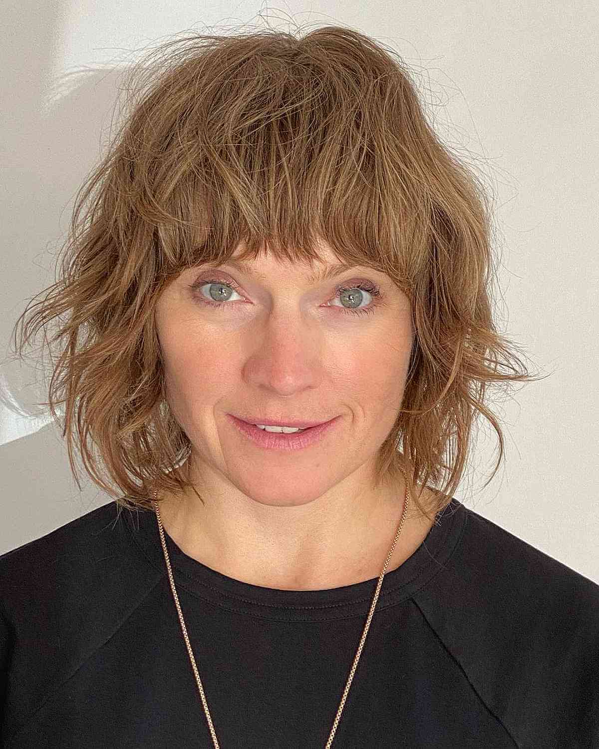 Chin length cut with tousled layers and bangs