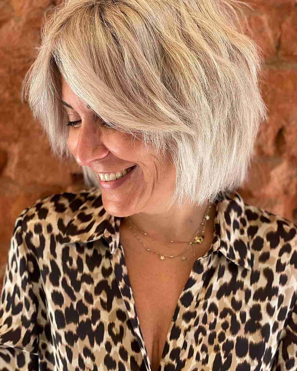 Chin-Length Face-Framing Blonde Choppy Hair for Women Over 50