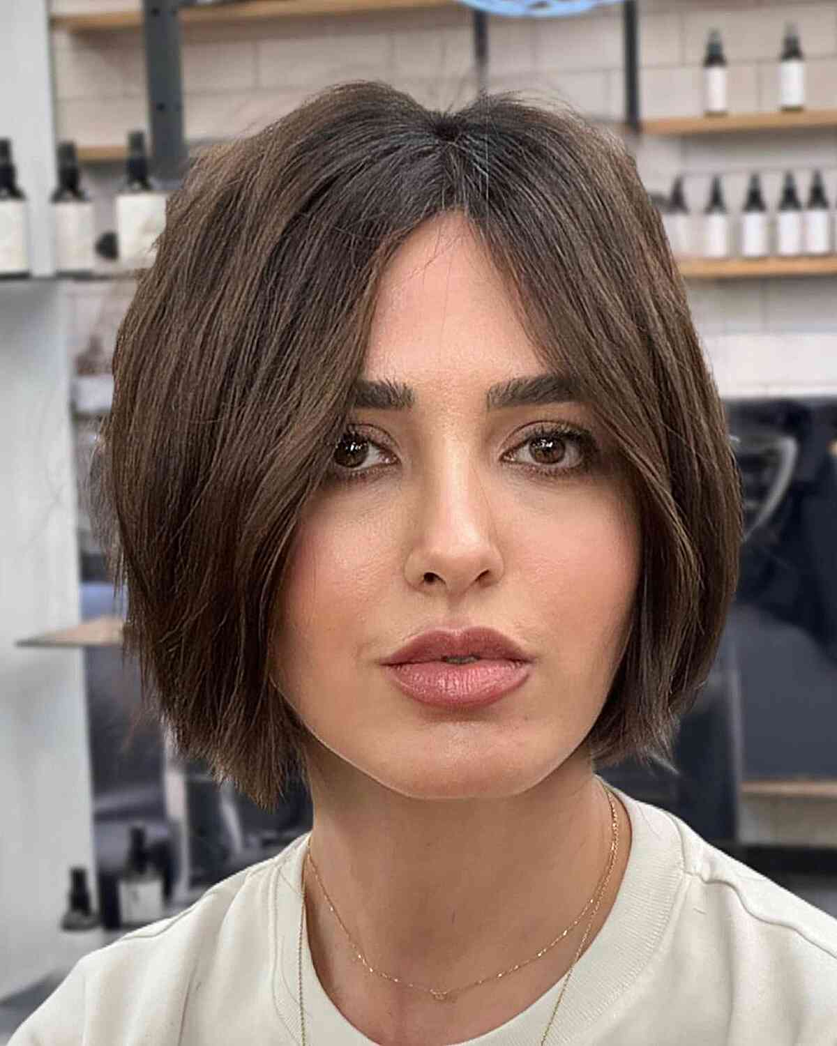 Chin-Length Ghost Cut Bob for women with face-framing hair