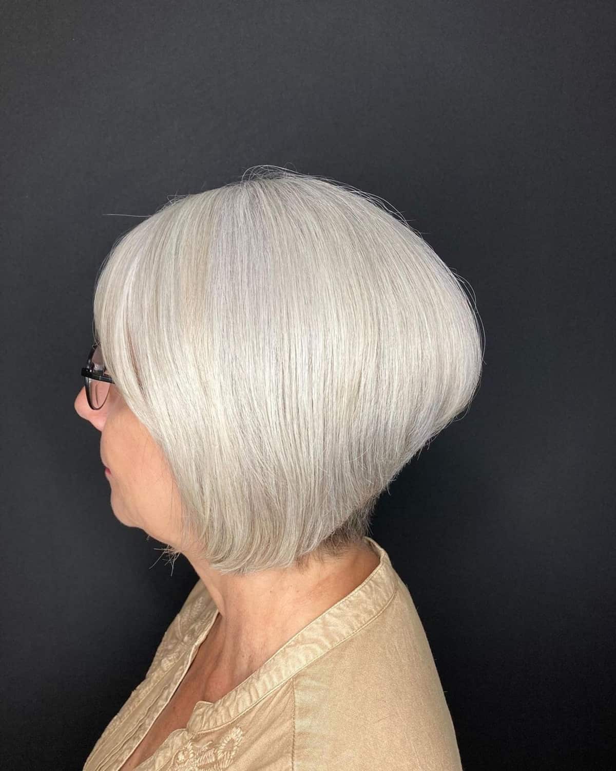 Chin-length graduated bob for women over 60 with glasses