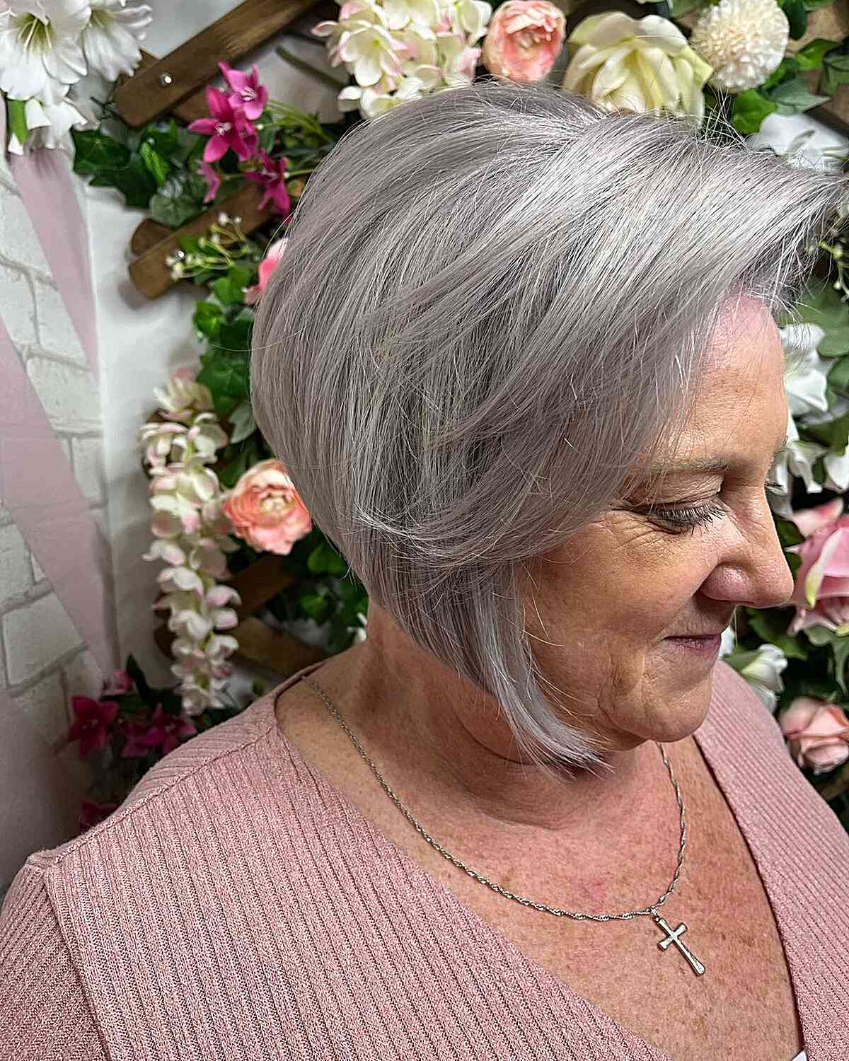 Chin-Length Silver A-Line Bob with Long Bangs on Mature Women