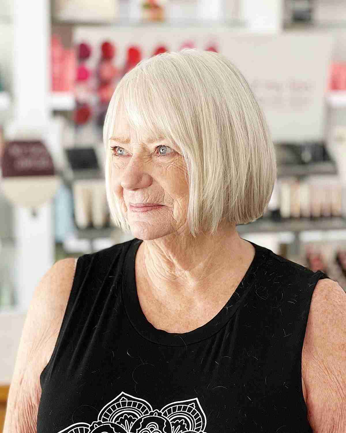 Chin-Length White Blonde Bob with Side Bangs for Women Over 60