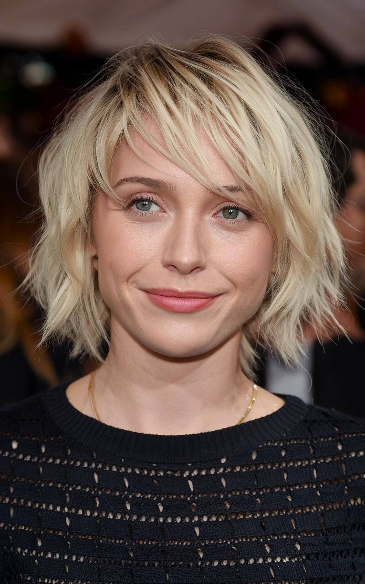 Choppy blonde bob with shaggy layers and platinum blonde color