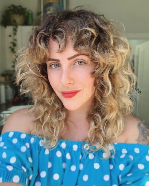 Choppy Curly Hair with Dark-Rooted Blonde Color