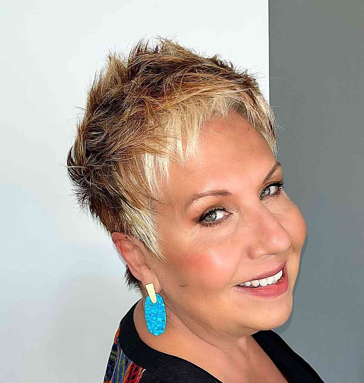 Choppy Fringe with a Spikey Top on a Choppy Pixie Cut for women with golden blonde hair