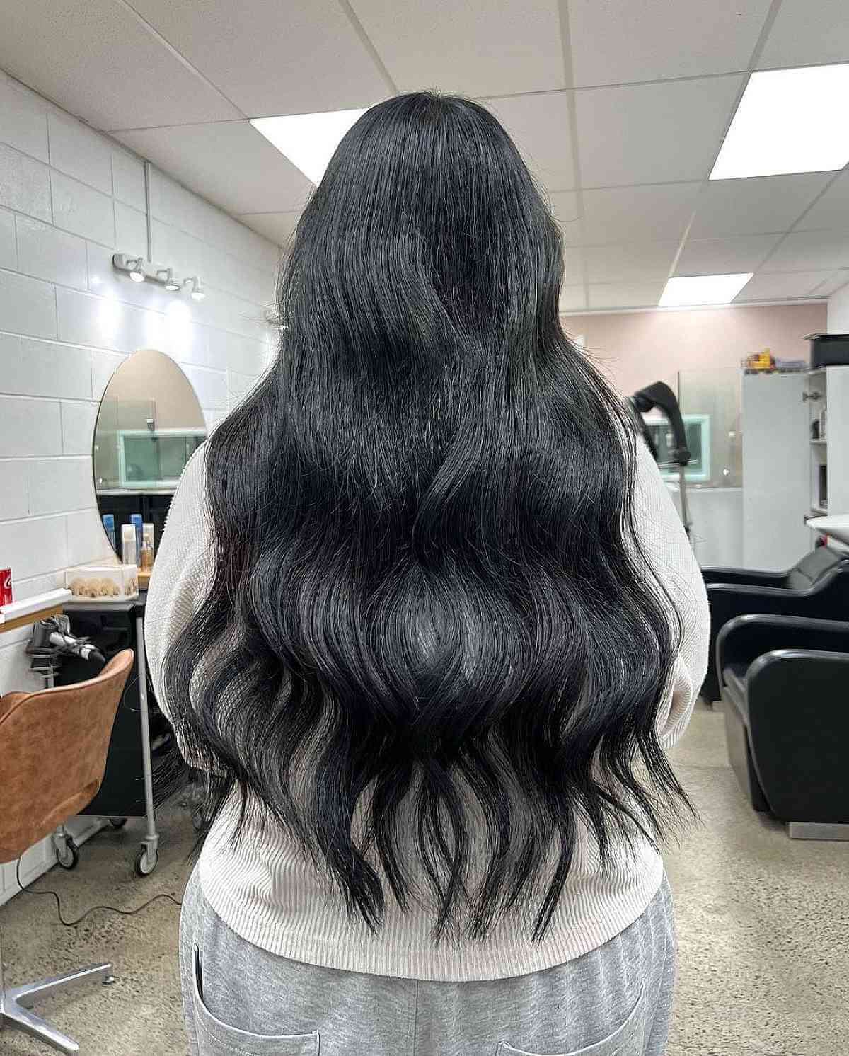 Tousled long black hair with waves
