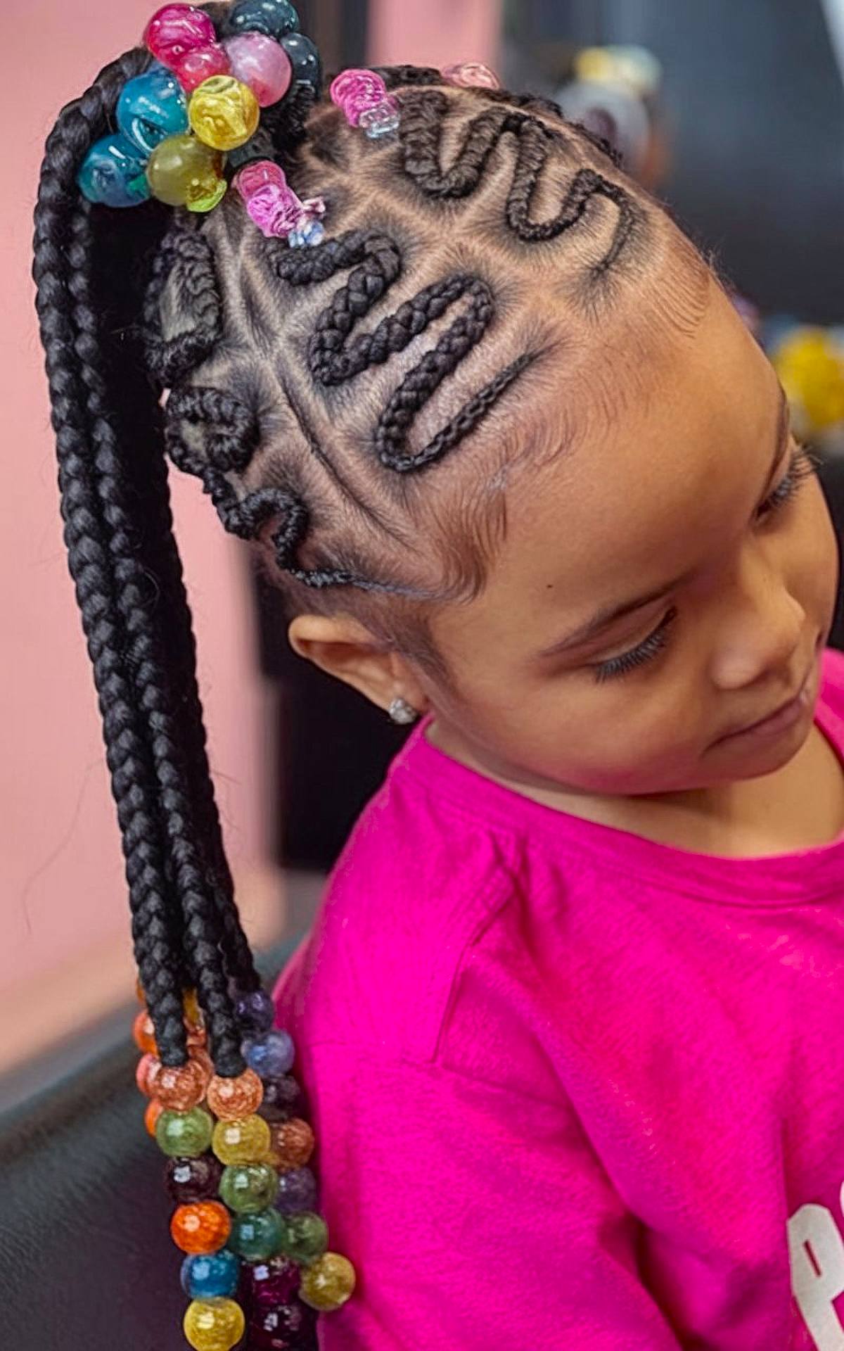 Zigzag braids with colorful beads, perfect for a festive Christmas hairstyle for Black kids