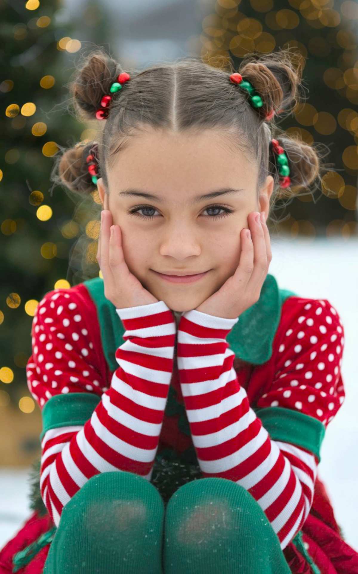 Christmas space buns with jingle bells, perfect for a playful holiday hairstyle