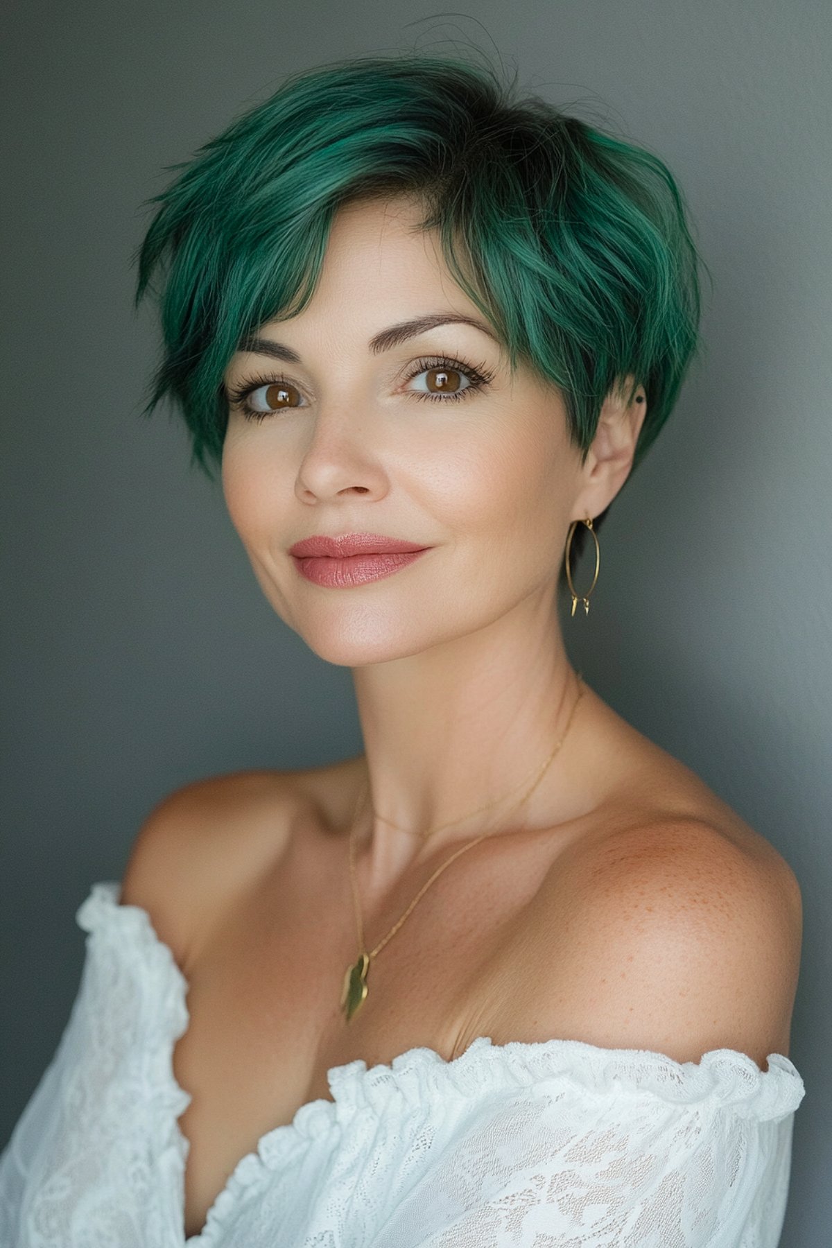 Christmas hair color idea with emerald green pixie cut