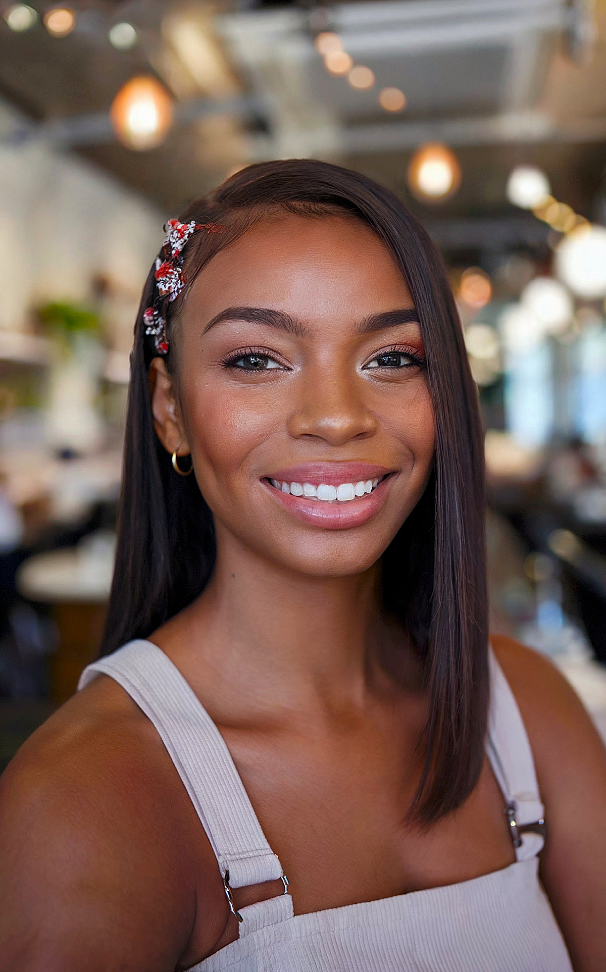 Sleek side-part hairstyle with holiday accessories for Black women