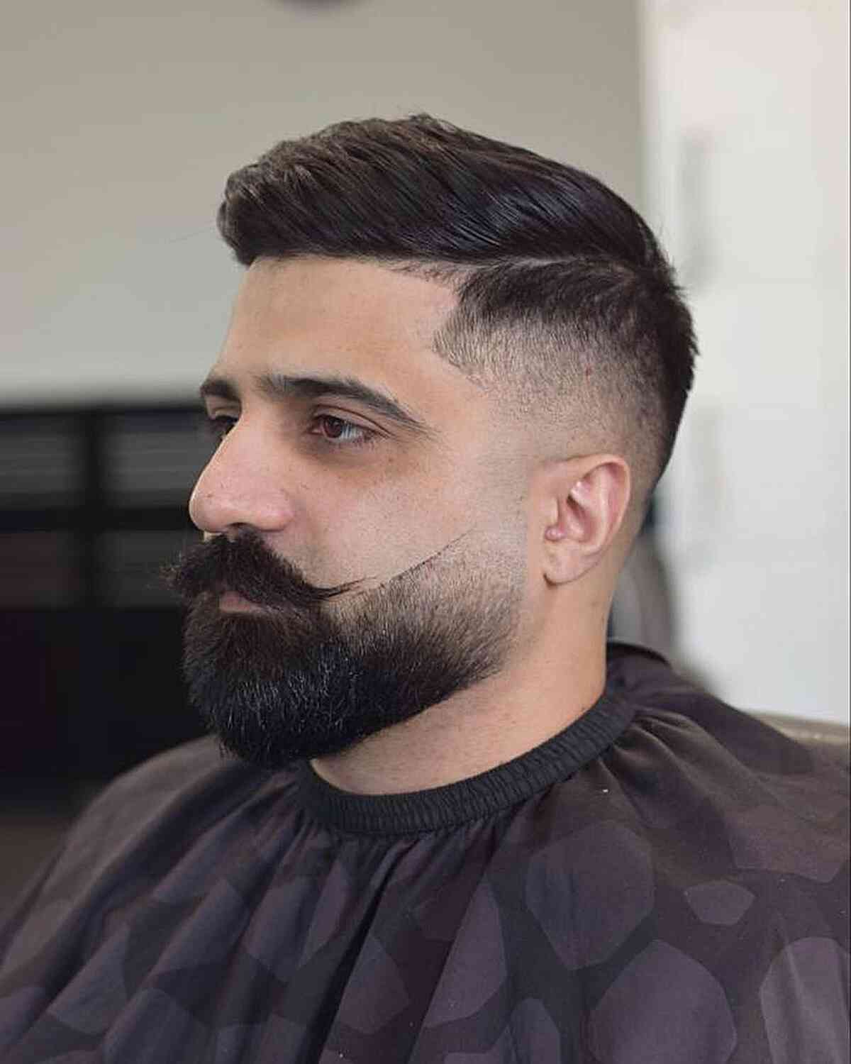 Classic comb over with a beard fade for men with thick hair