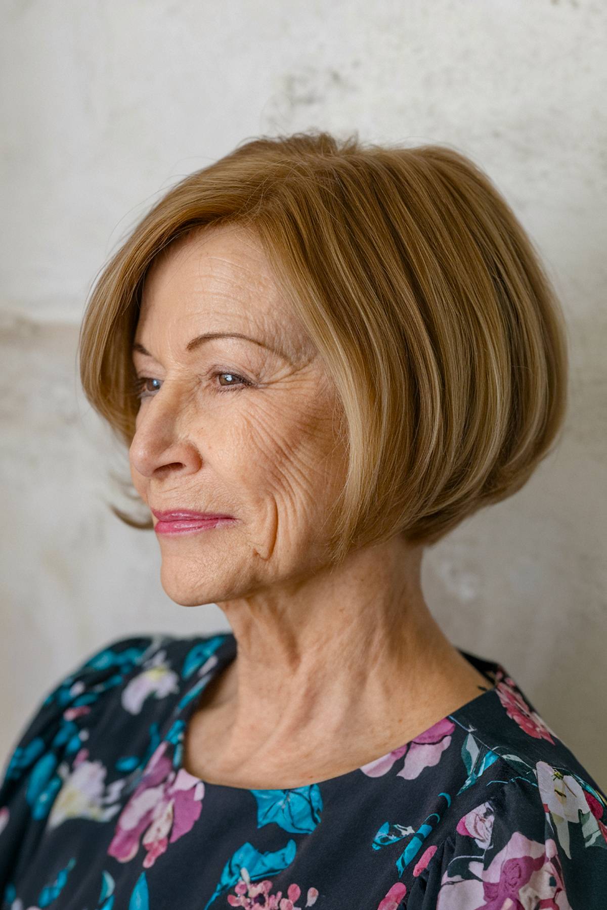 A refined classic taper bob with soft graduation at the nape, offering a timeless, structured style for older women