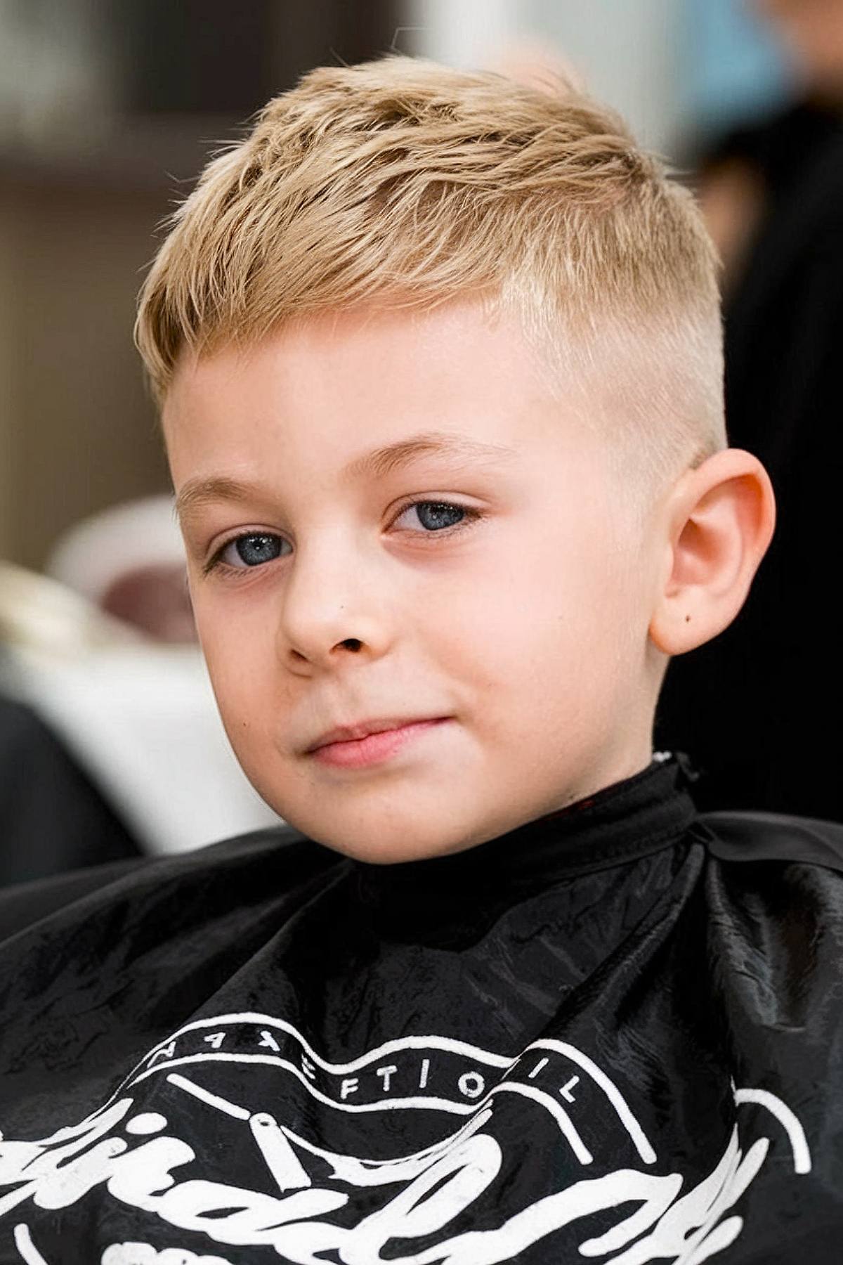 Classic short toddler boy haircut with layered texture