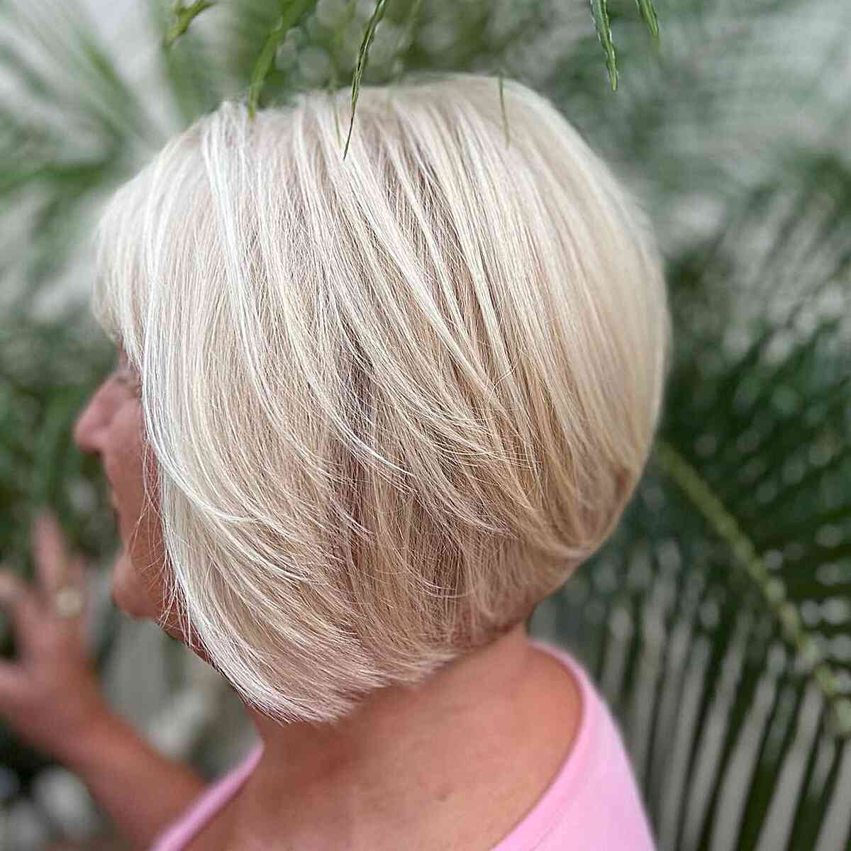 Classic Wedge Feathered Bob with Subtle Layers for Older Ladies Past 60 with Blonde Hair