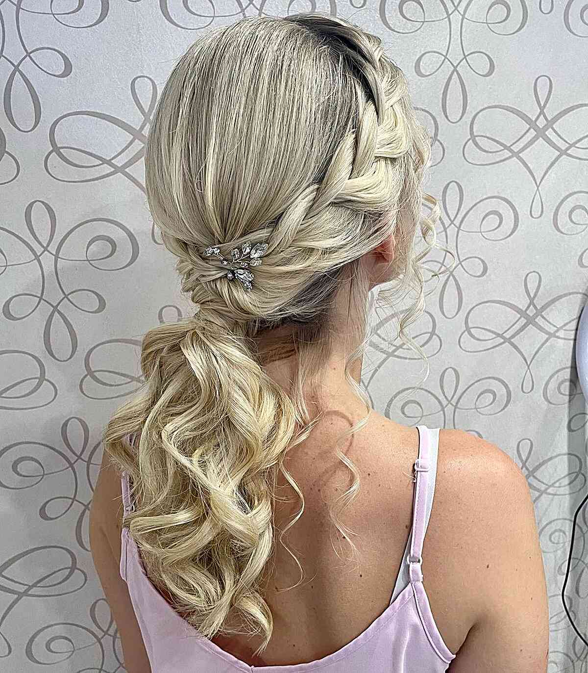 Romantic Coiled Low Pony with Medieval Braid for Mid-Length Hair