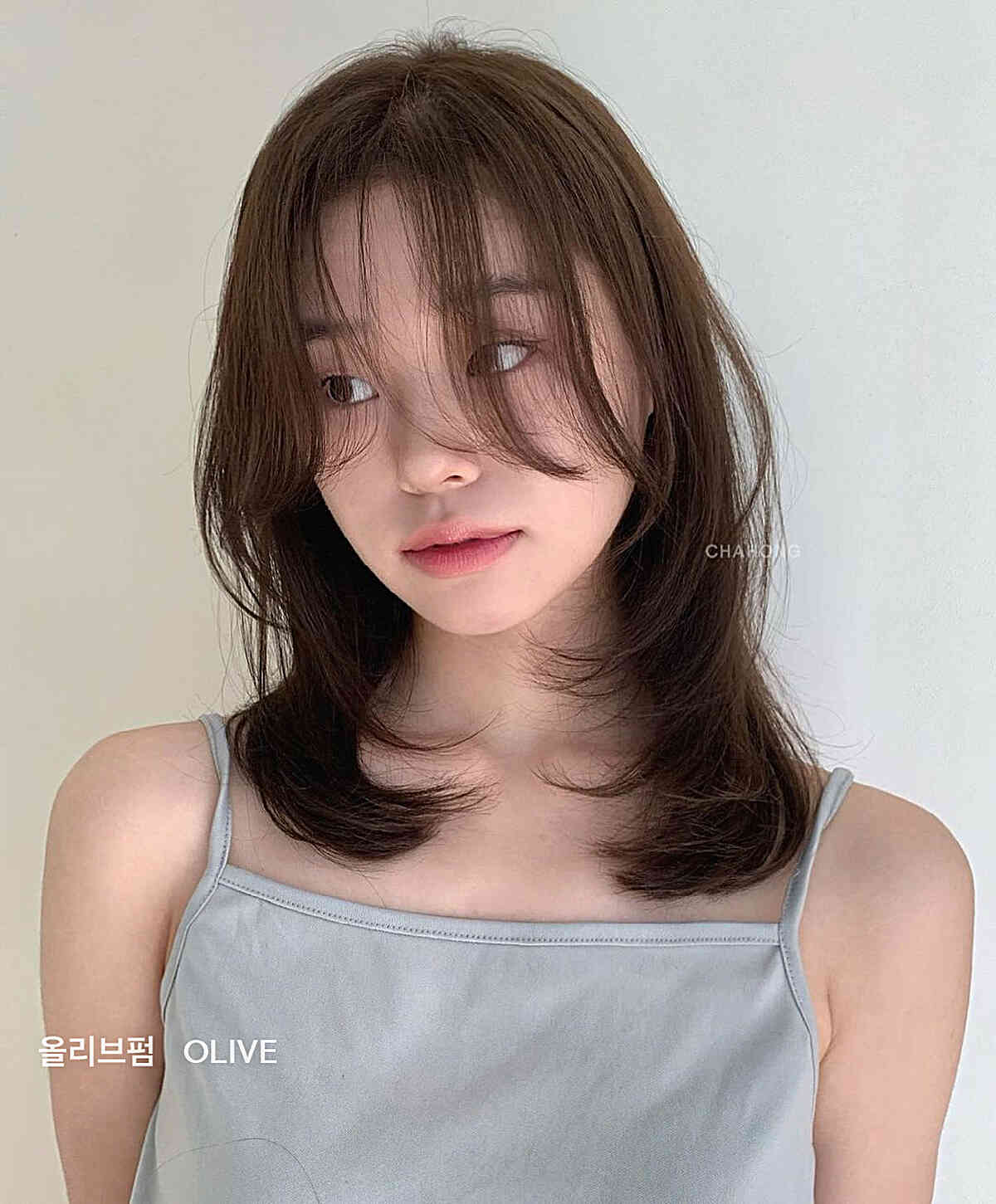 Collarbone-Length Layers with Long Bangs for Thin Hair
