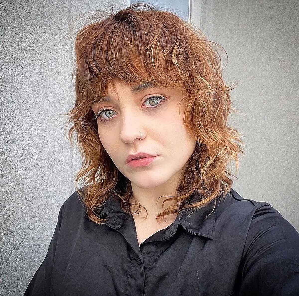 Collarbone-Length Shag Haircut with Bangs and Waves
